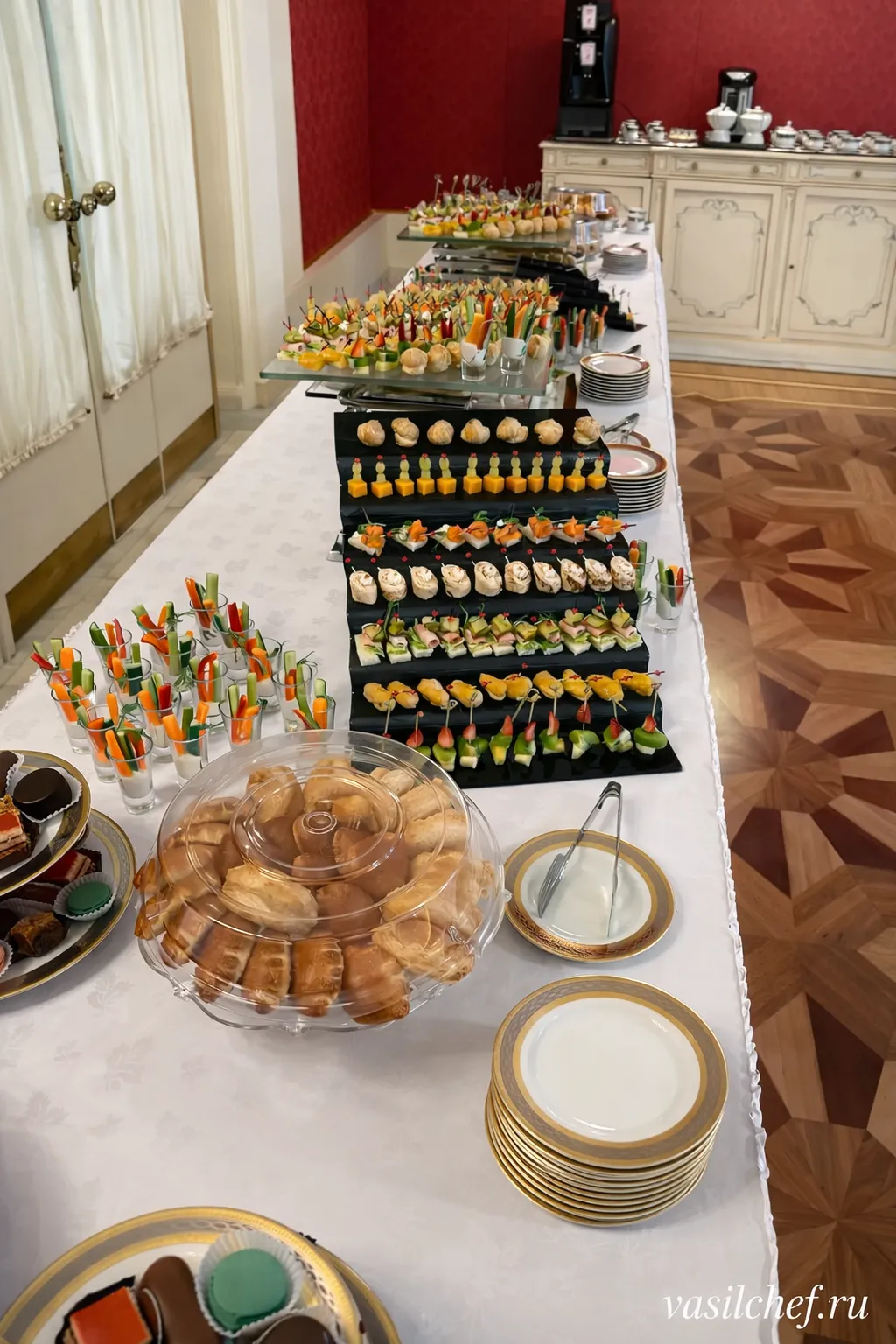 Banquet table with warm pastries and appetisers